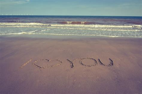 Premium Photo Text On Sand At Beach