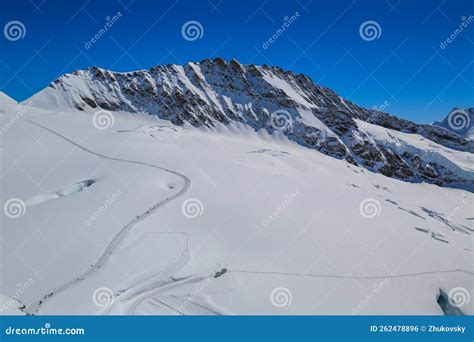 Winter in the Swiss Alps stock photo. Image of cable - 262478896