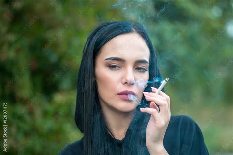 Sexy Brunette Girl Smoking Cigarette Stock Photo Adobe Stock