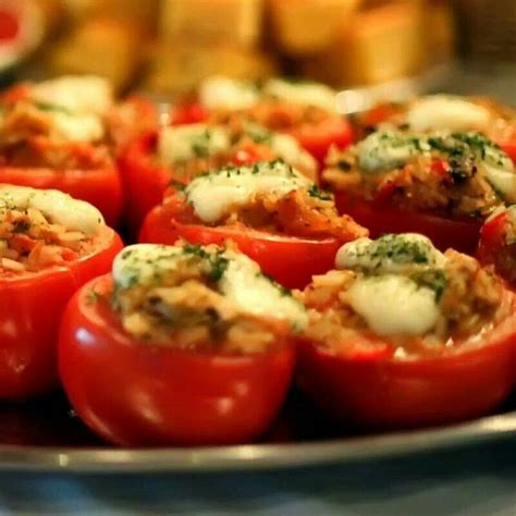 Stuffed Tomatoes With Cheese And Herbs In A White Casserole Dish