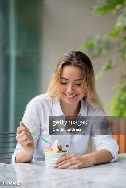 Woman Eating Ice Cream Sundae Photos and Premium High Res Pictures - Getty Images