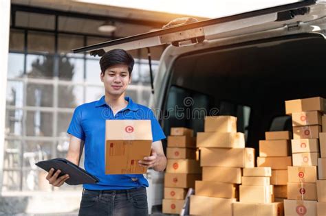 Smiling Delivery Asian Man Standing In Front Of His Van Portrait Of