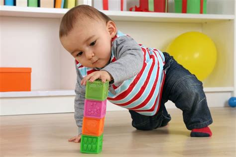 Baby playing with cubes stock image. Image of toddler - 48954295