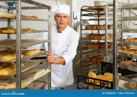 Male Baker Carrying Rack Trolley With Bread Stock Image Image Of