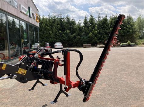 Taille haie sécateur pour chargeur euro et Schmetz SA