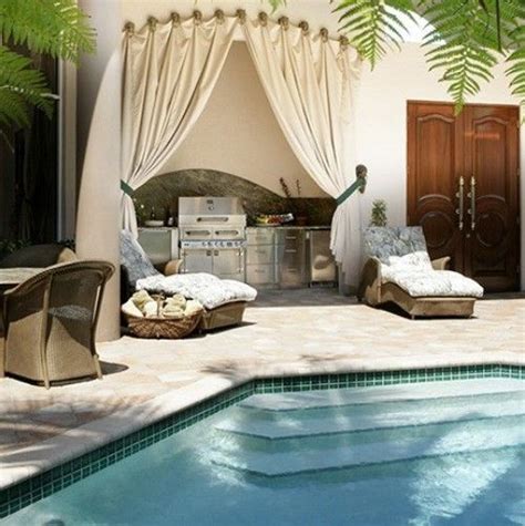 an outdoor living area next to a swimming pool