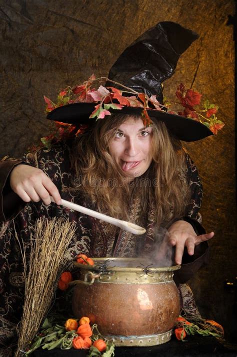 Halloween Witch Cooking A Potion In A Cauldron Stock Photo Image Of