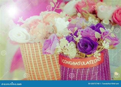 Closeup Bouquet Of Red Artificial Flower With Word Congratulations