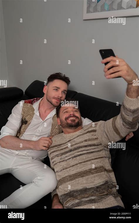 Gay Couple Relaxing On Sofa Hi Res Stock Photography And Images Alamy