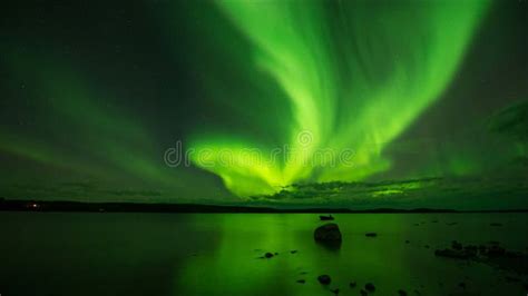 Aurora Glowing Purple Green And Milky Way Galaxy Over Horizon Southwest