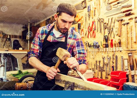 Carpenter With Wood Hammer And Chisel At Workshop Stock Image Image