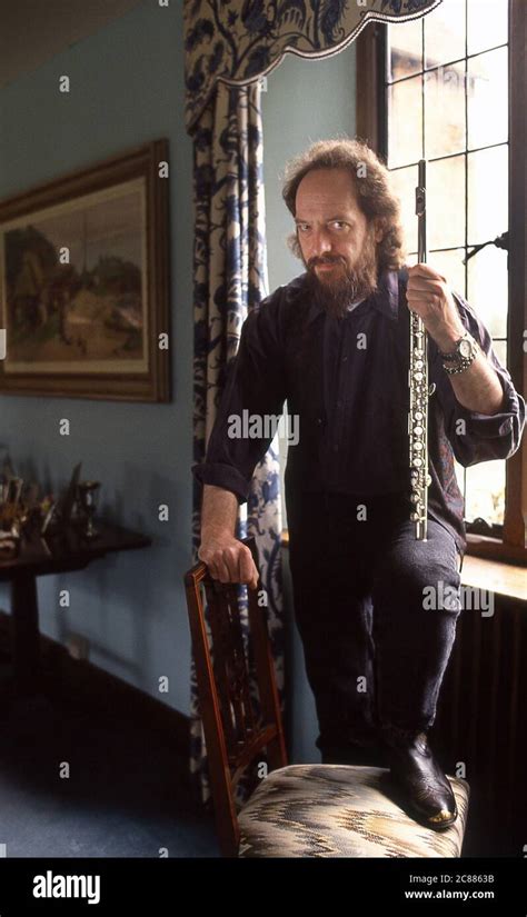 Ian Anderson Of Jethro Tull Playing The Flute At Home In Stock