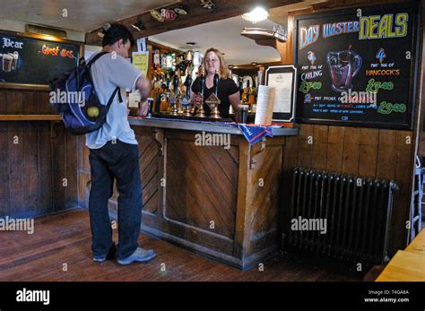 An Oxford student Inside the Blue Boar pub in Blue Boar Lane, Oxford, Britain Stock Photo - Alamy