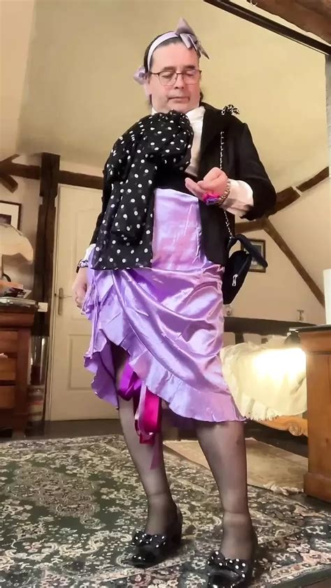 Outfitted With A Lila Skirt With A Slit On The Side For An Evening Gay