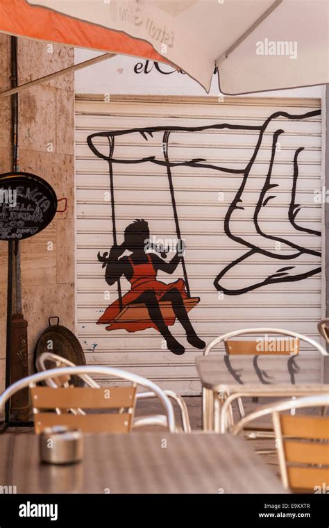 Girl Swinging From A Finger Graffiti In Valencia Spain Stock Photo