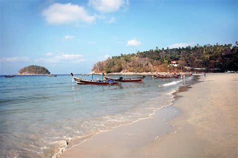 Premium Photo Traditional Longtailed Boats On The Sea Beach Against