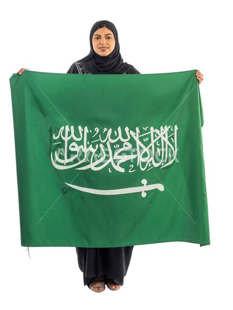 Portrait Of A Saudi Arabian Gulf Woman Holding The Flag Of The Kingdom