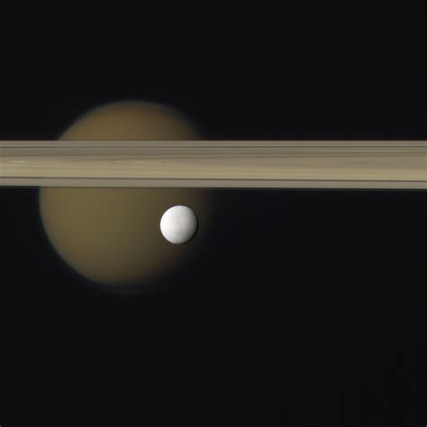 Photo Treat Enceladus Titan And Saturn S Rings Universe Today