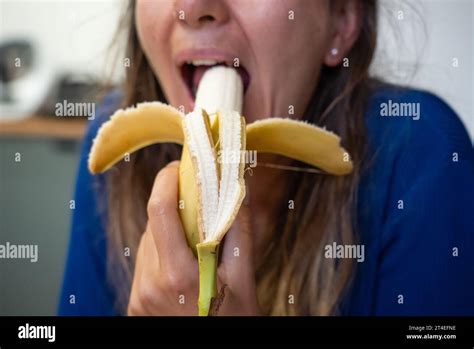 Woman Eats Food Woman Eats Banana Close Shot Of Girl Eating Bananas