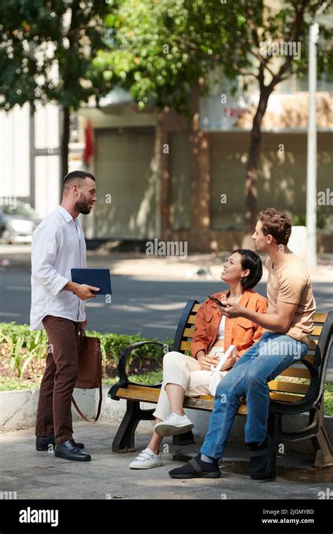 Group Of Adult Friends Hanging Out Outdoors After Work Stock Photo Alamy