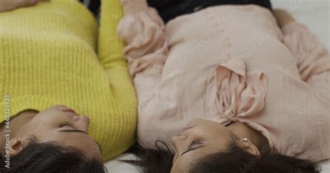 Cute Indian Lesbian Couple Lying Down And Looking At Each Other Indoors Stock Photo Adobe Stock