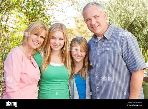 Happy family smiling Stock Photo - Alamy