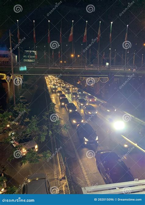 Tehran Traffic in City at Night Iran Flag Mirdamad Bridge Stock Photo