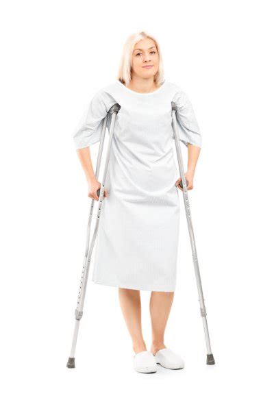 Female Patient Posing With Crutches Stock Photo By ©ljsphotography 59506645