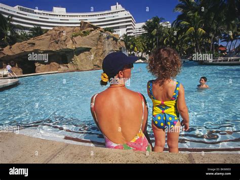 Tourists swim in the swimming pool at the Fontainebleau Hotel in Miami Beach, Florida Stock ...