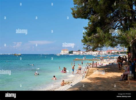 Tourists On The Beach In Porec In Croatia Stock Photo Alamy