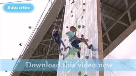 Children Climbing Rock Wall While Climbing Competition Stock Footage