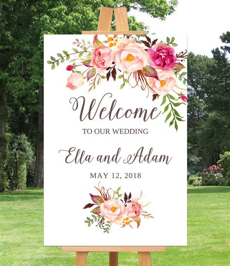 A Welcome Sign With Flowers On It