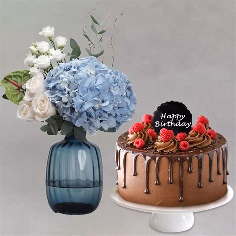 Online Captivating Mixed Flowers In Blue Glass Vase With Chocolate Cake