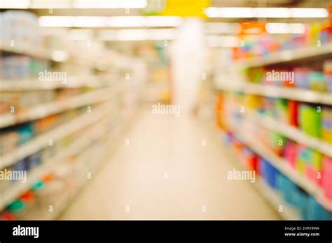 Empty Supermarket Aisle and Shelves in blurry for background Stock ...