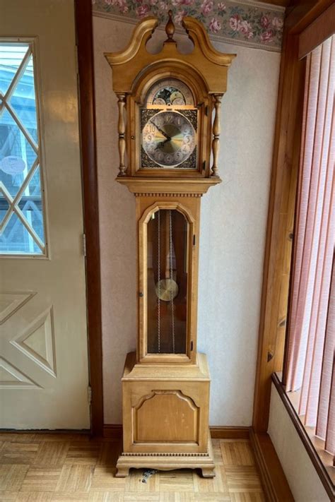 Colonial Of Zeeland Grandmother Clock And Regulator Wall Clock In 2024