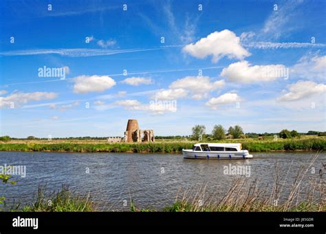 A Boat On The River Bure In The Norfolk Broads National Park About To