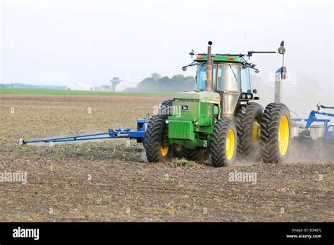 John Deere Tractor Planting Corn Or Soybeans In An American Farm Field