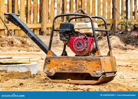 Vibratory Plate Compactor To Firm Soil At Construction Site Compact