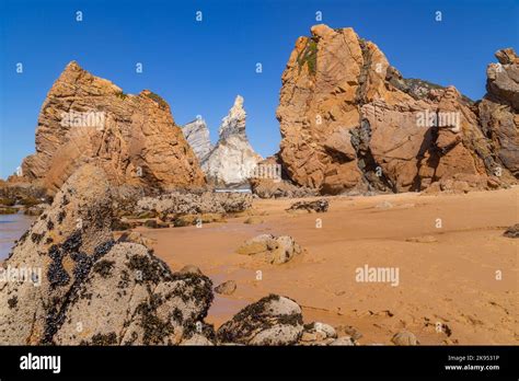 Towering Rock Cliffs At Praia Da Ursa Beach Sintra Portugal Atlantic