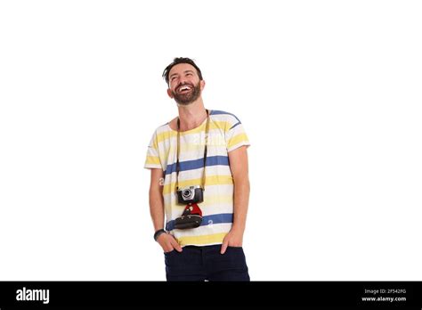 Portrait Of Smiling Mature Man With An Old Camera Standing Relaxed Over White Background Stock