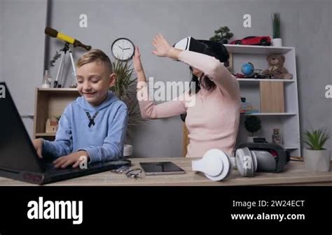 Beautiful Brunette Woman In Vr And Her Smiling 10 Aged Son Using Computer At Home Stock Video