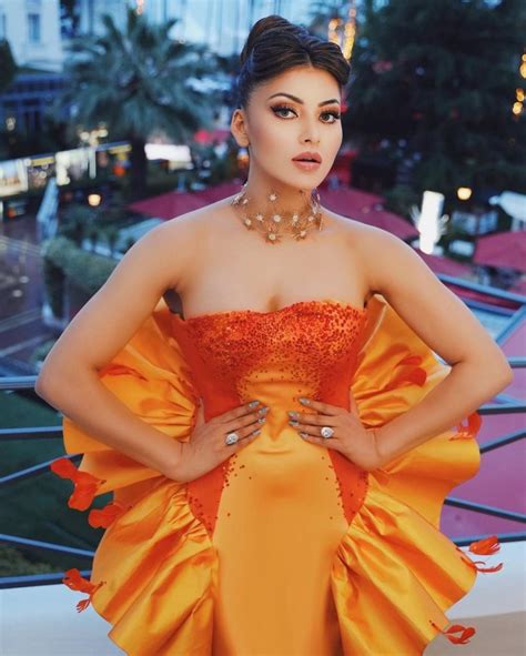 India At Cannes Urvashi Rautela Stuns In Hot Orange Flower Strapless