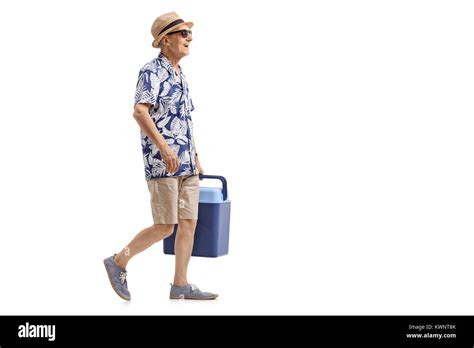 Full Length Profile Shot Of An Elderly Tourist With A Cooling Box