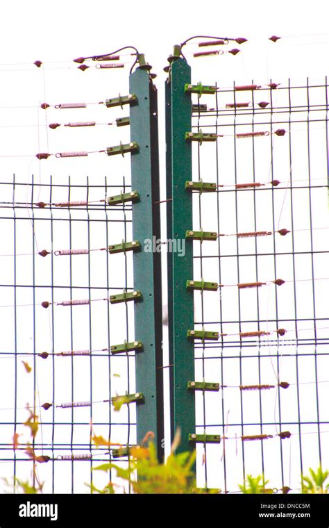 Detail Of Electrified Security Fence On Boundary Of Premises Stock