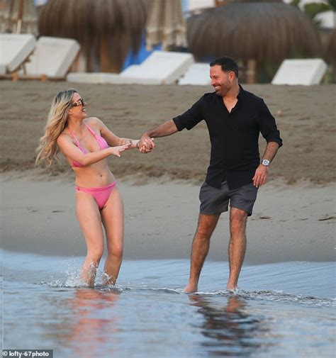 Helen Flanagan Shows Off Her Toned Figure In A Pink Bikini As She Packs On The Pda With New