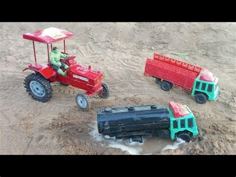 Dumper Truck Vehicle In Mud Stuck Tractor Loading In Video