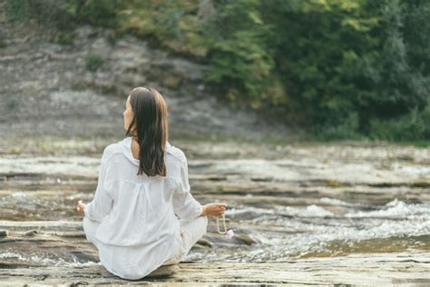 Premium Photo Peaceful Woman Is Making Mantra Meditation Near River