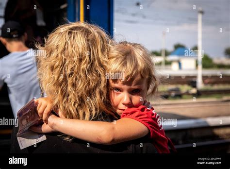 1. A young girl cries as she is evacuated from her home in eastern Ukraine.