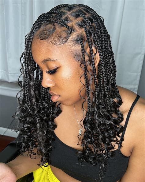 1. Box Braided Bun with Curly Ends: