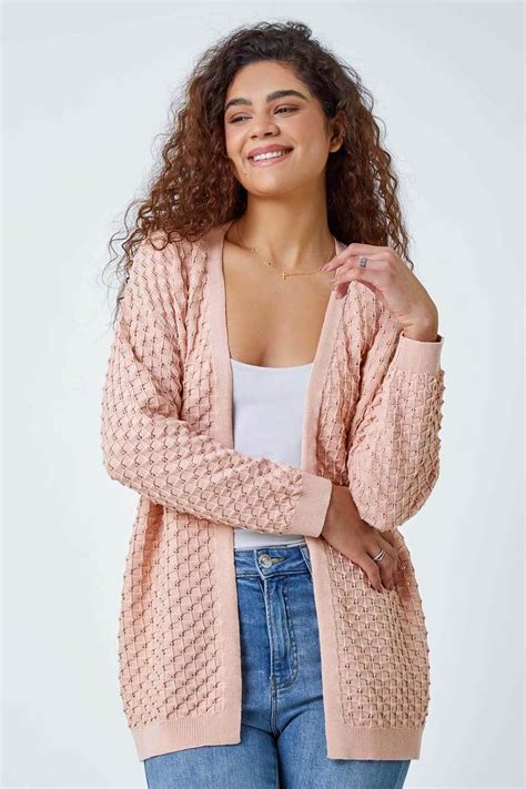 1. Eleven's Signature Pink Dress with Waffle Knit Cardigan